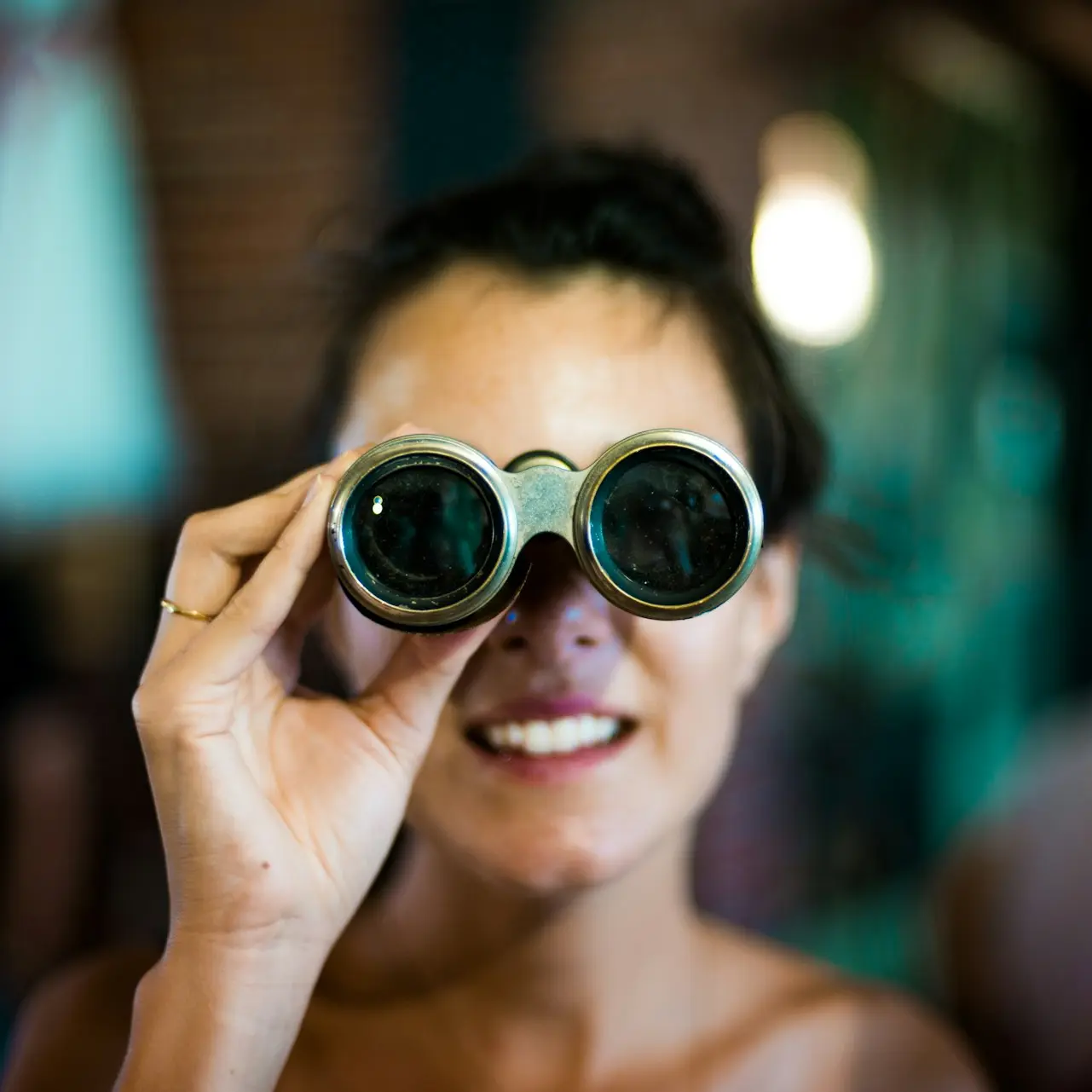 woman using gray binoculars